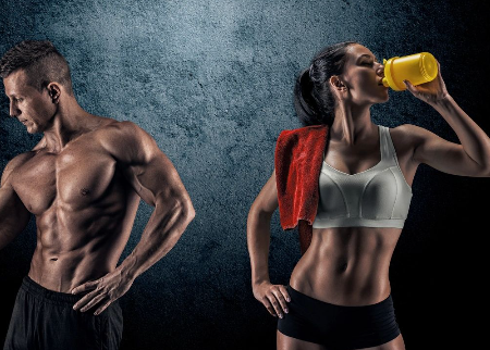 A man and woman drinking from a bottle.